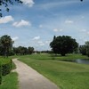 A view of the 18th green with clubhouse in background at Poinciana Country Club