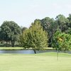 A view of a green with water in background at Schalamar Creek Golf Club