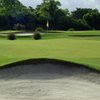 A view of green with bunker in foreground at Miami Shores Country Club