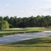 A view of the 11th green with bunkers on sides at Spruce Creek Country Club