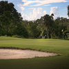 A view of a green with bunker in foreground at Riverside Golf Course