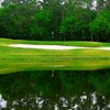 A view over the water of green at The Golf Club of Cypress Creek