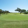 A view of the 18th hole with birds on the left at Sandridge Golf Club - Dunes Course