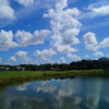 View of the clubhouse over the lake at White Heron Golf Club