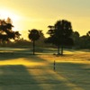 A sunrise view of a green at Indian Spring Country Club.