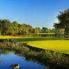 A sunny day view of a hole at Fiddlesticks Country Club.