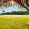 A sunny day view of a fairway at Riverside Golf Course.