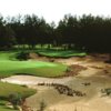 A view of a green surrounded by sand at World Woods Golf Club.