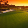 A sunset view of a hole at Plantation Bay Golf and Country Club.