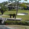 A view of the clubhouse with putting green on the right at Sawgrass Country Club