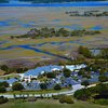 Aerial view of the clubhouse and parking area at Marsh Creek Country Club