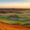 A sunset view of a green at Blue Course from Streamsong Resort.