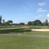 A view of a green protected by a bunker at Seminole Lake Country Club.