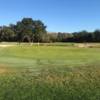 A sunny day view of a green at Charlotte Harbor National Golf Club.