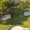 Aerial view of green protected by bunkers at Avila Golf & Country Club