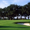 A view of the 11th green surrounded by bunkers at Brooksville Country Club.