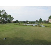 Cimarrone Golf Club puts two par 5s back to back. The 14th hole is a dogleg right around water.