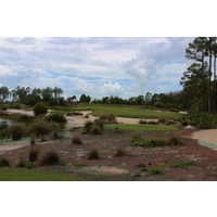 The par-3 second introduces the beauty and challenges at Old Corkscrew Golf Club in Estero, Florida. 