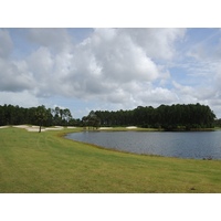 The fifth hole at Venetian Bay Golf Club is reachable in two, but it plays around a lake.