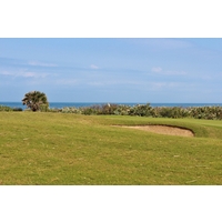 The ninth green on the Ocean Course at Hammock Beach Resort is one of several spots where golfers can see the Atlantic Ocean crash upon the shore. 
