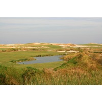 The fifth hole on Streamsong Resort's Red Course is a dogleg right around water.